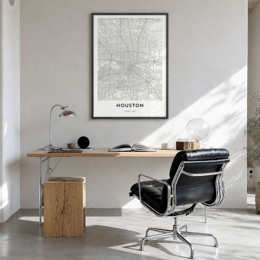 Houston Map Poster in a black wood frame, hanging in a bright home office