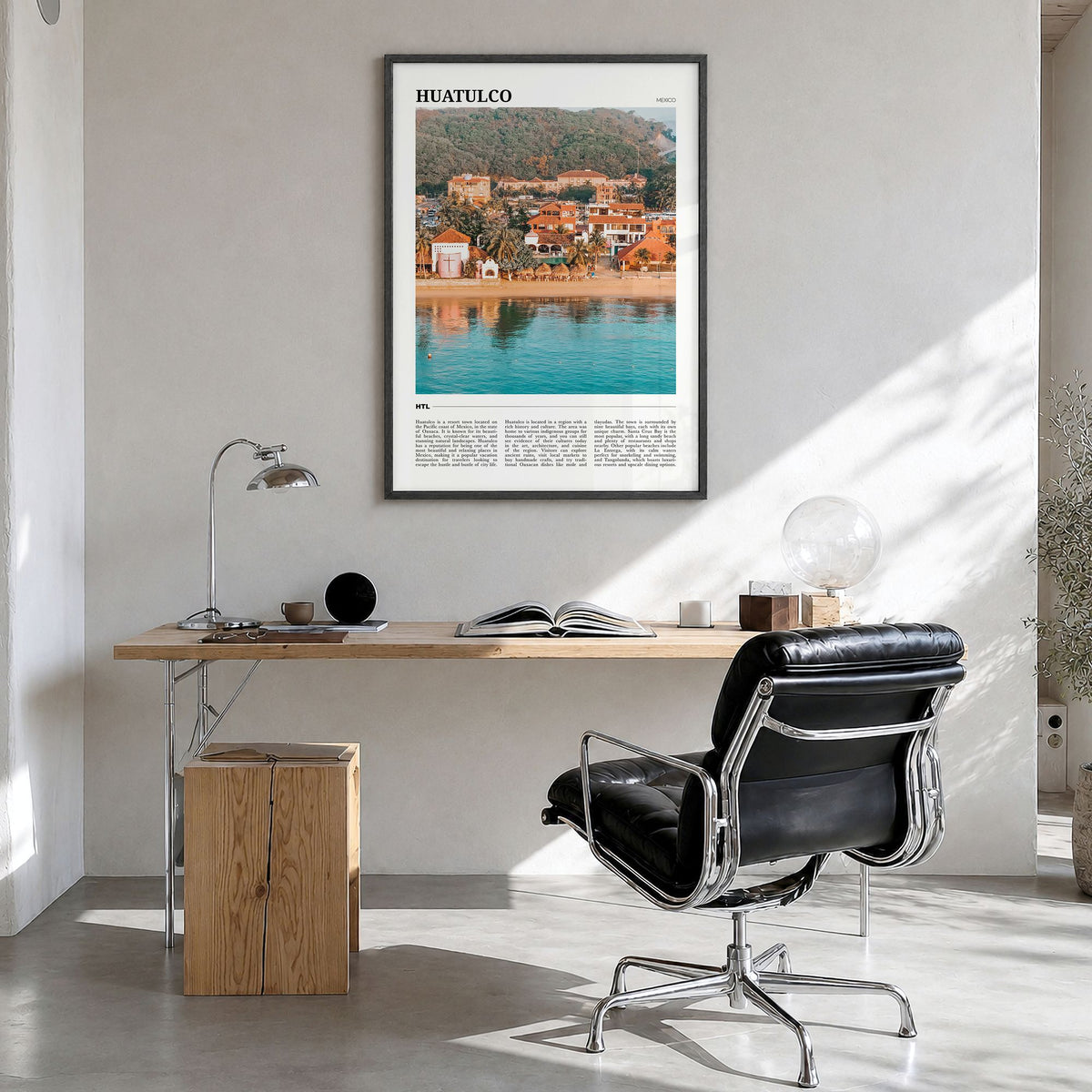 Huatulco Travel Poster in a black wood frame, hanging in a bright home office