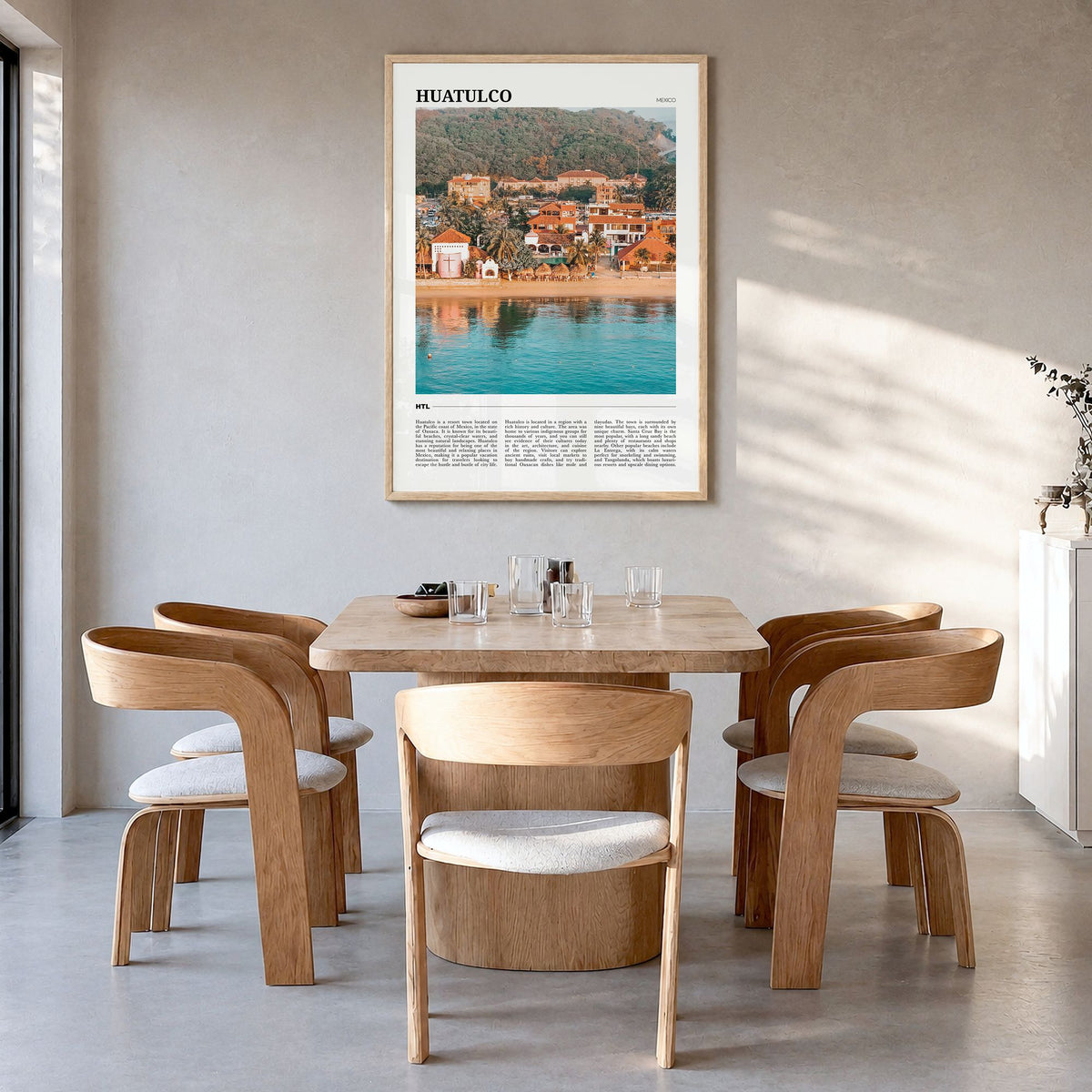 Huatulco Travel Poster in a natural wood frame, hanging in a dining room