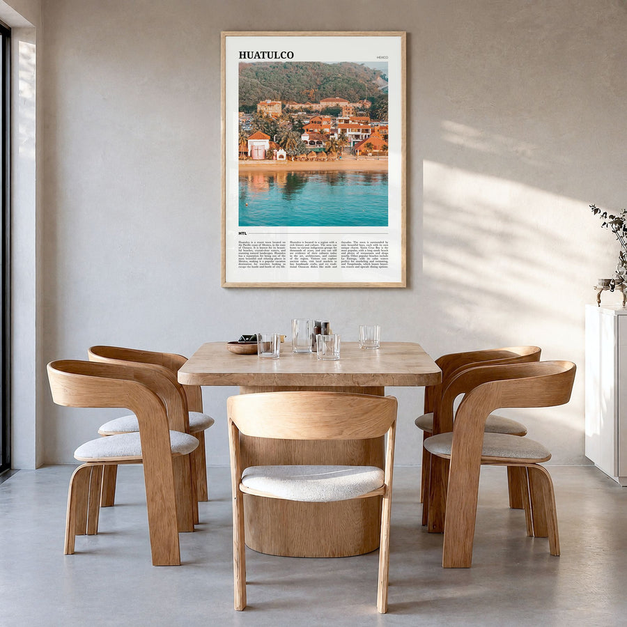 Huatulco Travel Poster in a natural wood frame, hanging in a dining room