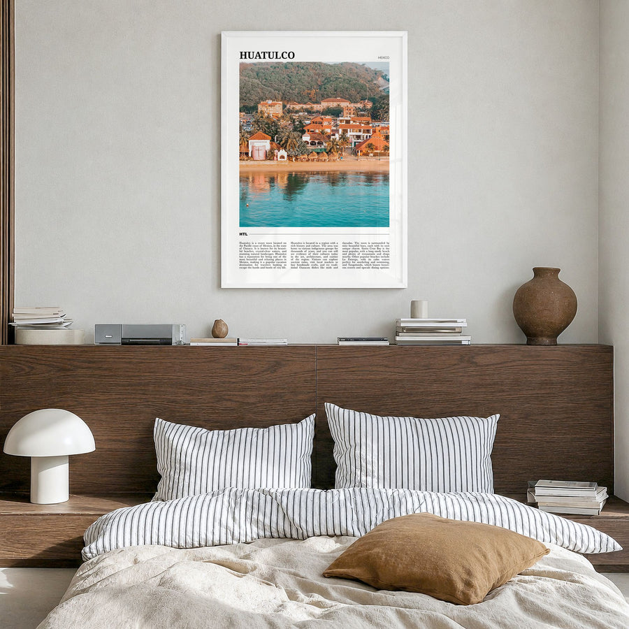 Huatulco Travel Poster in a white wood frame, hanging in a bedroom