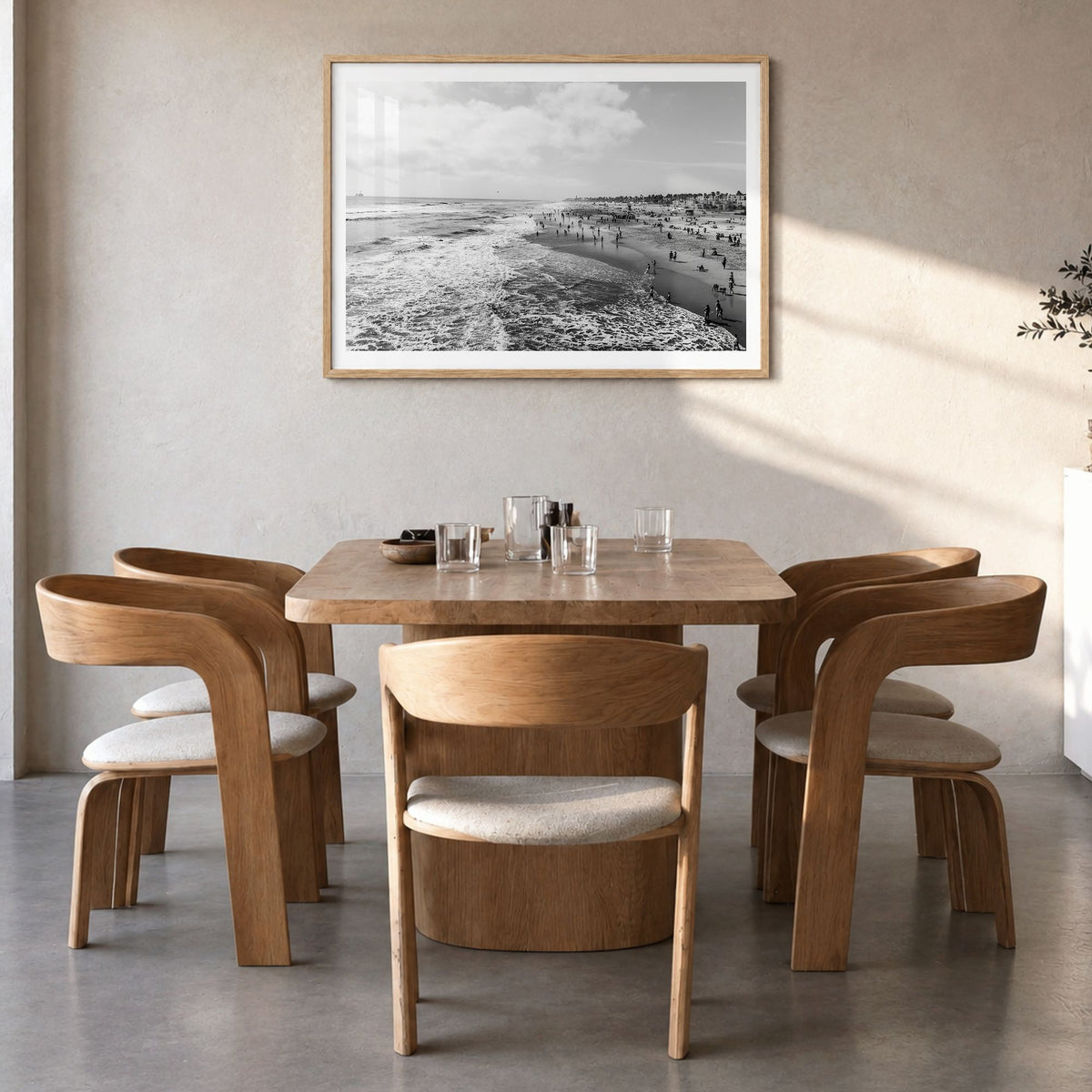 Huntington Beach Photo Poster in a natural wood frame, hanging in a dining room, white border