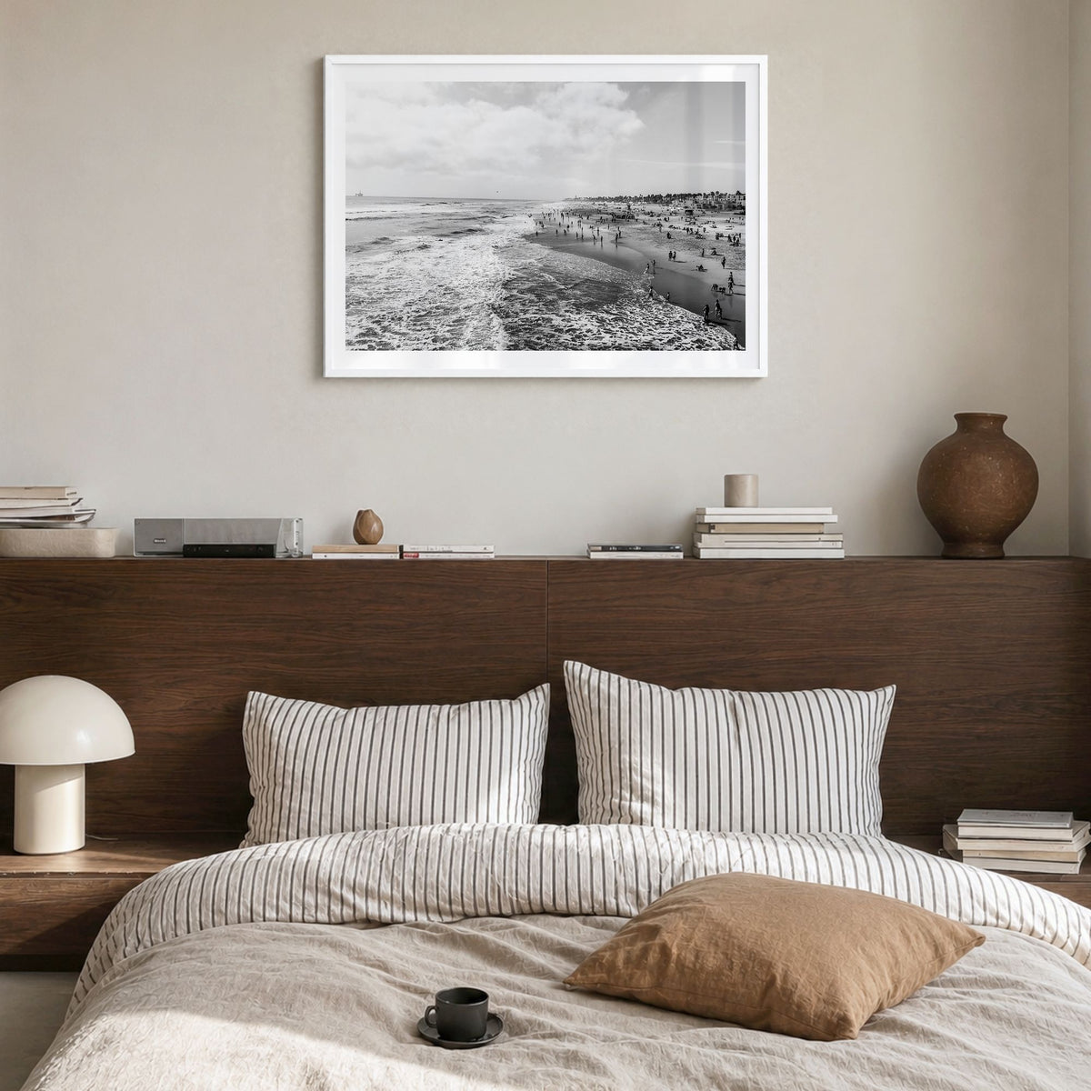 Huntington Beach Photo Poster in a white wood frame, hanging in a bedroom, white border