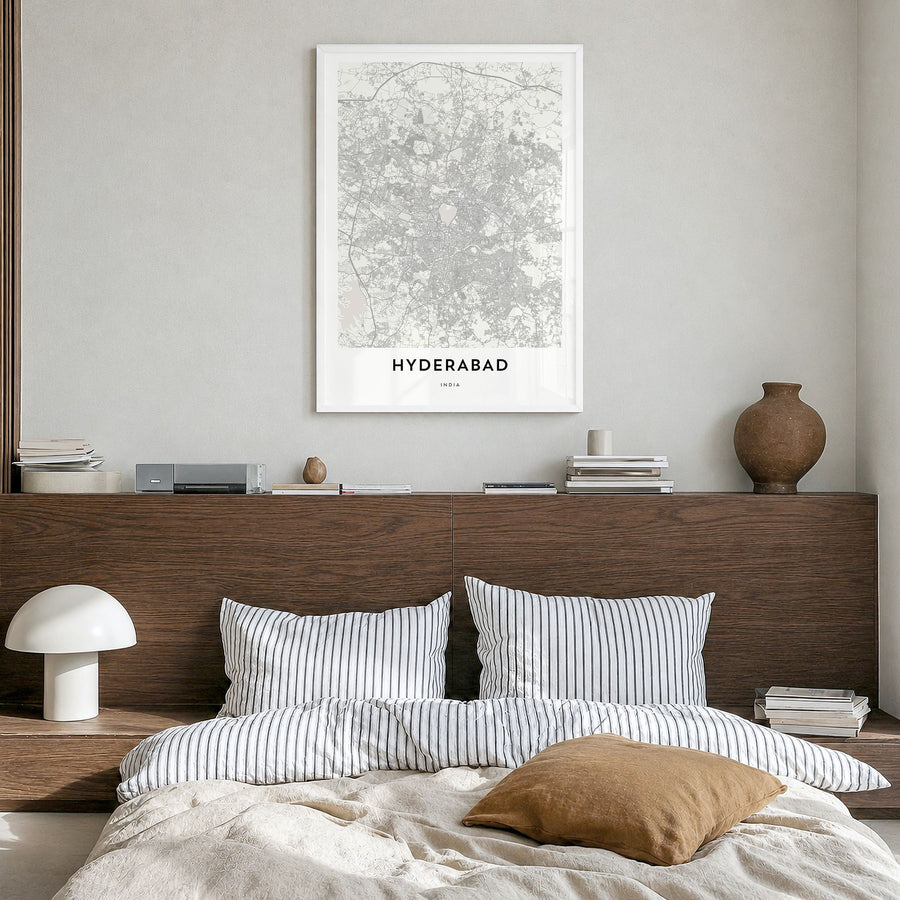 Hyderabad Map Poster in a white wood frame, hanging in a bedroom