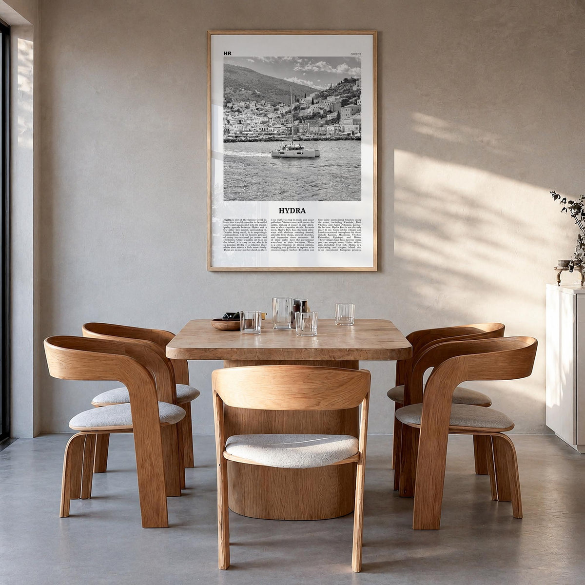 Hydra black & white newspaper poster of Greece – vertical wall art in natural wood frame, hanging on wall