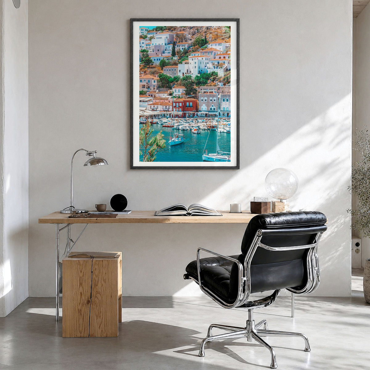 Hydra Photo Poster in a black wood frame, hanging in a bright home office, white border