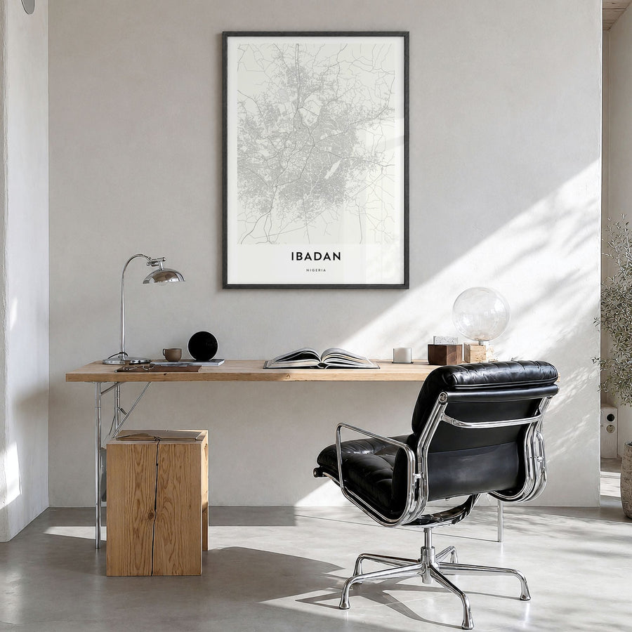 Ibadan Map Poster in a black wood frame, hanging in a bright home office