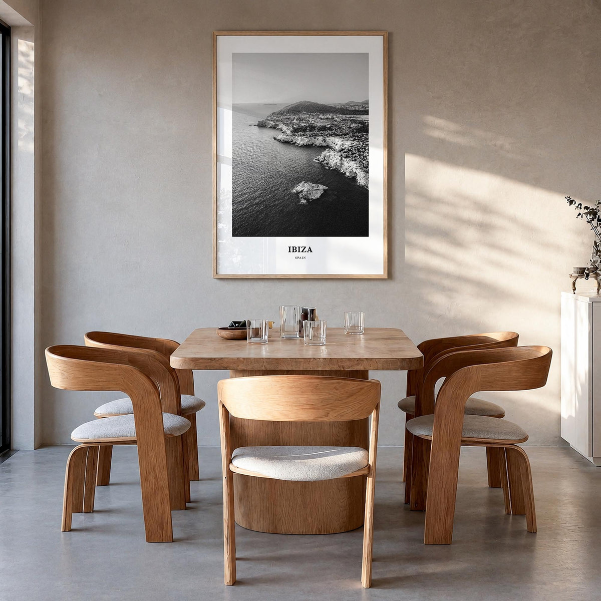 Ibiza black & white classic poster of Spain – vertical wall art in natural wood frame, hanging on wall