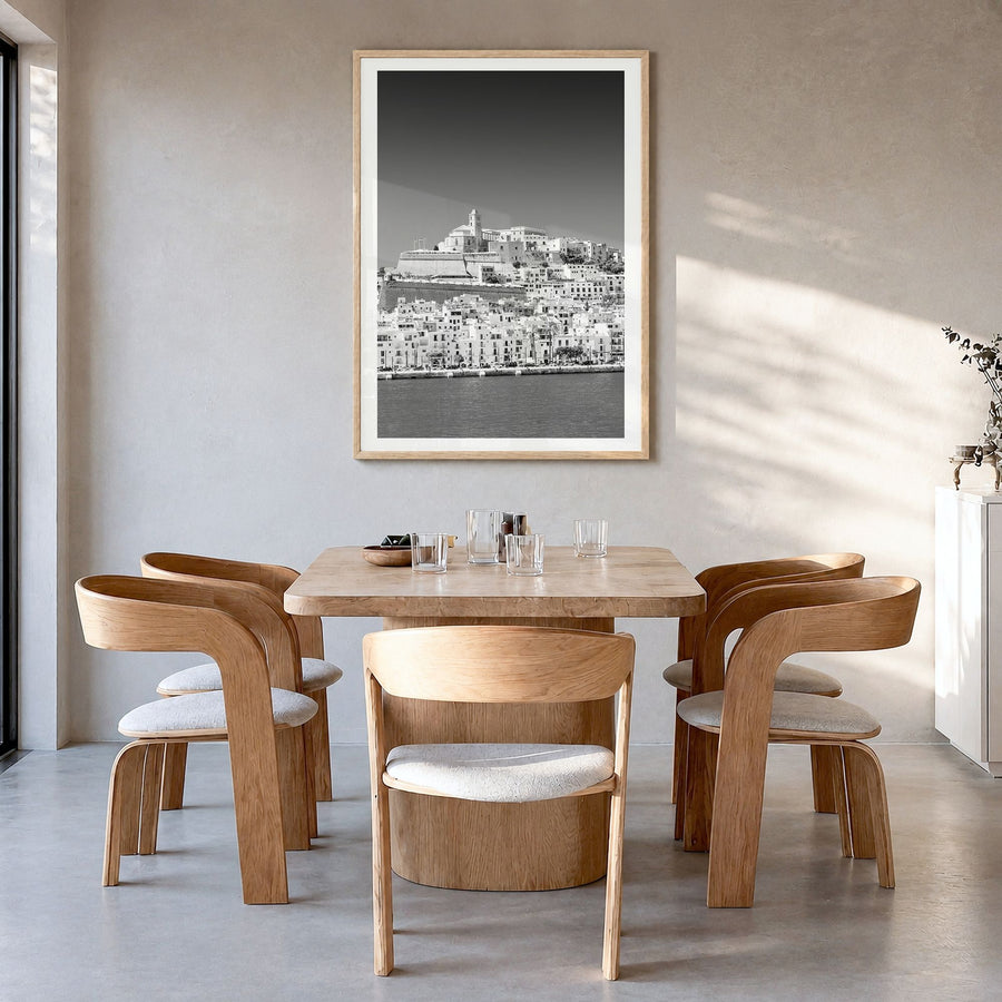 Ibiza Photo Poster in a natural wood frame, hanging in a dining room, white border