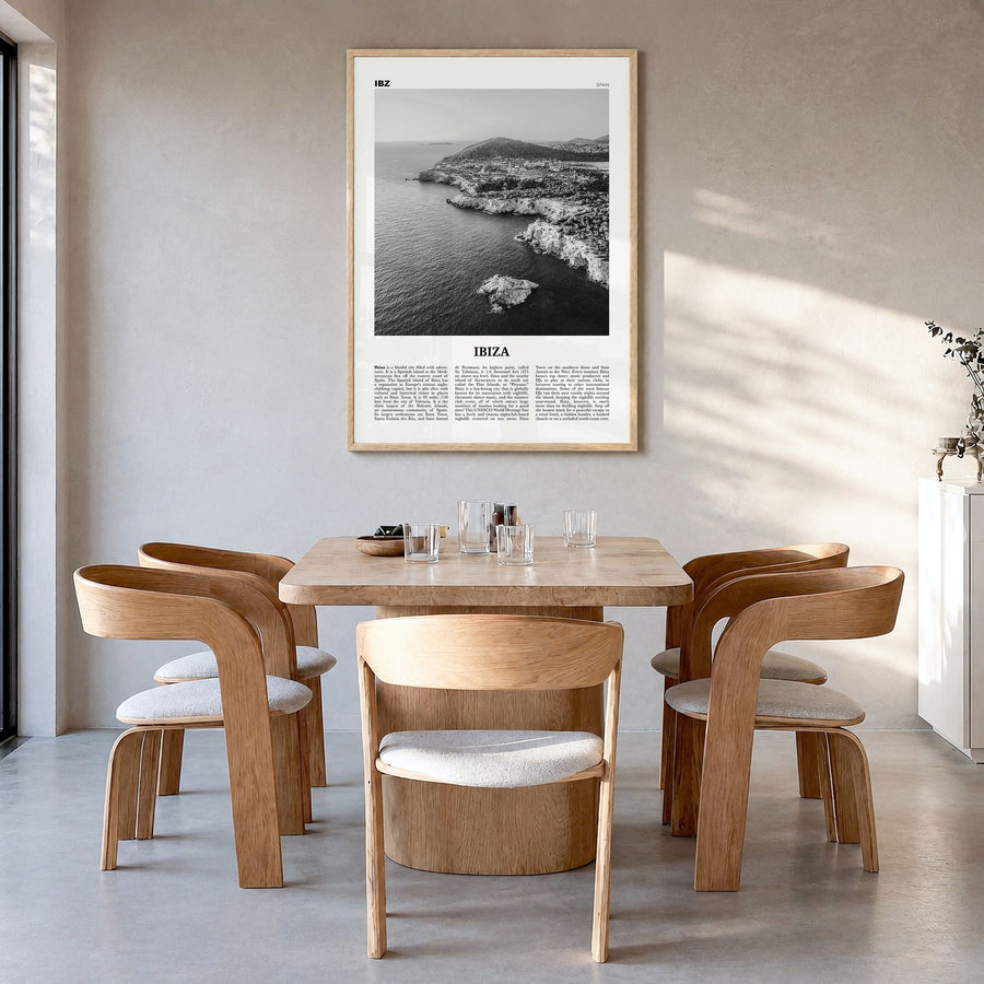 Ibiza Newspaper Poster in a natural wood frame, hanging in a dining room