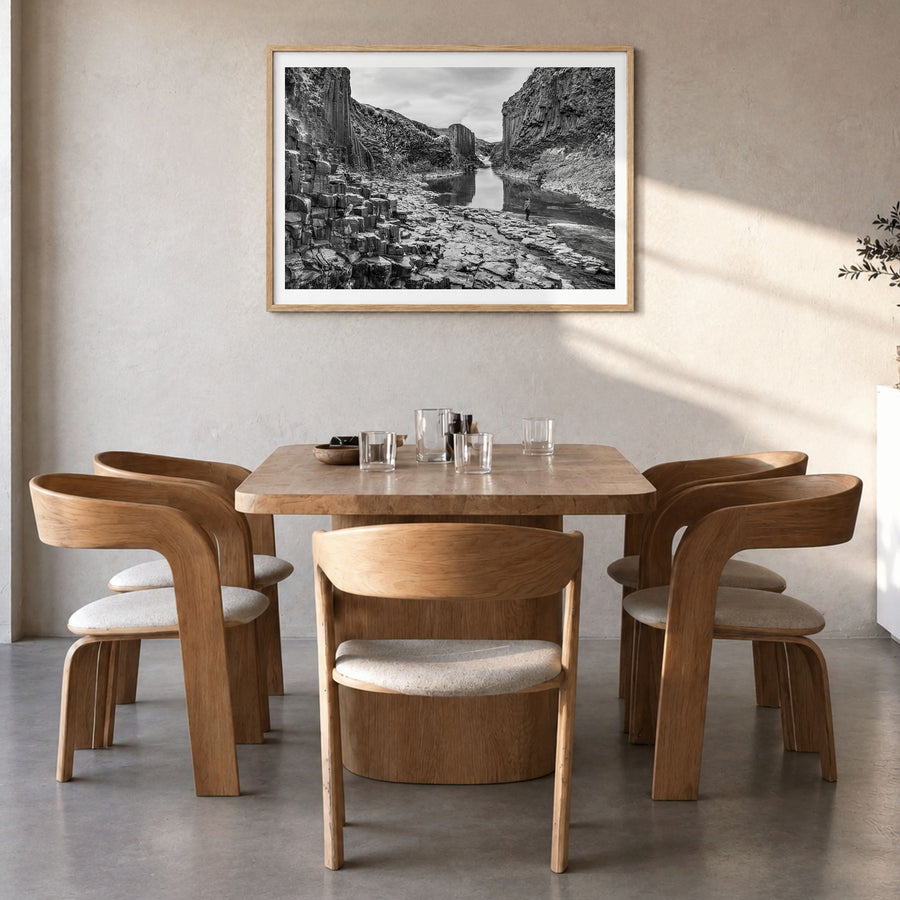 Iceland Photo Poster in a natural wood frame, hanging in a dining room, white border