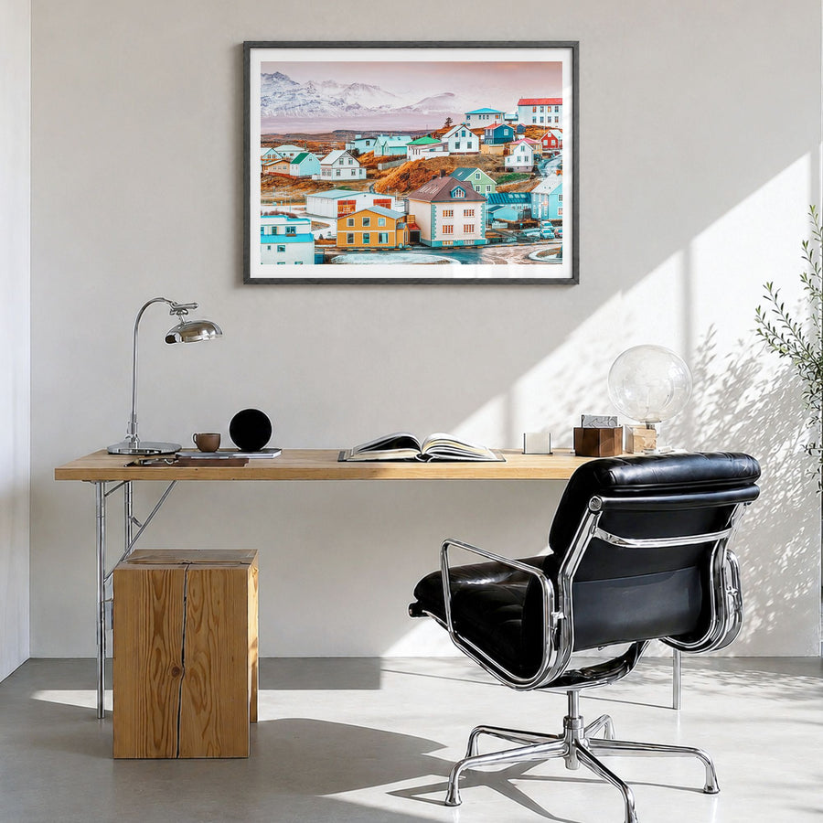 Iceland Photo Poster in a black wood frame, hanging in a bright home office, white border