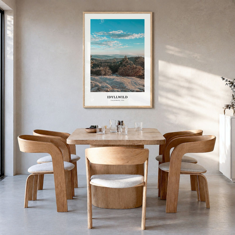 Idyllwild Classic Poster in a natural wood frame, hanging in a dining room