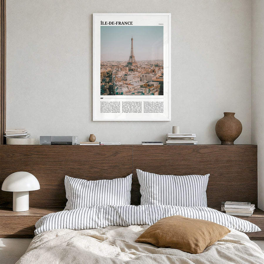Île-de-France Travel Poster in a white wood frame, hanging in a bedroom