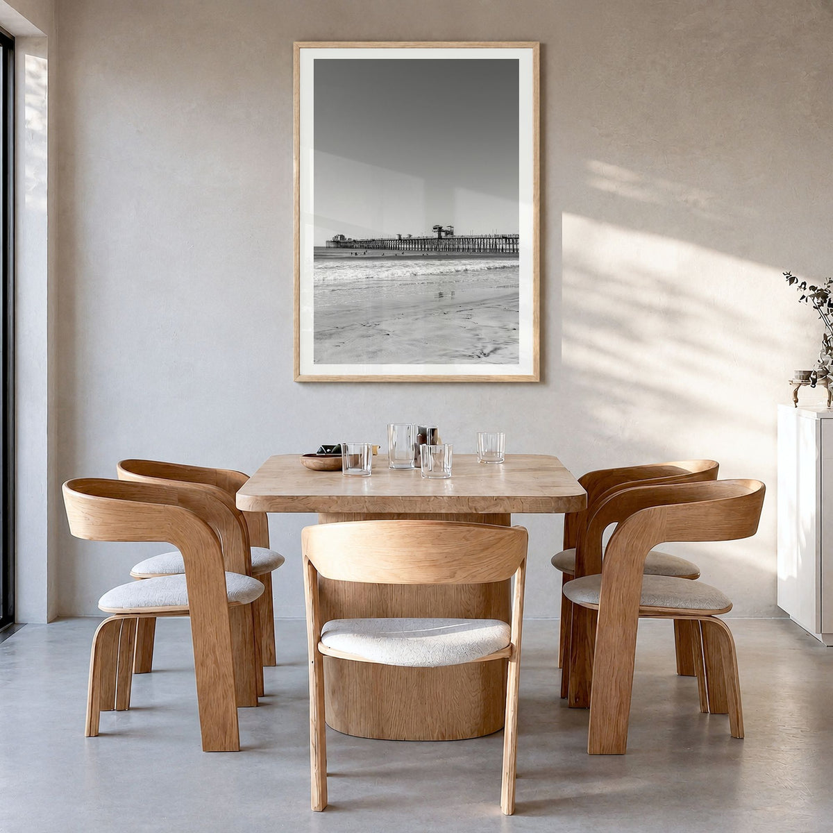 Imperial Beach Photo Poster in a natural wood frame, hanging in a dining room, white border