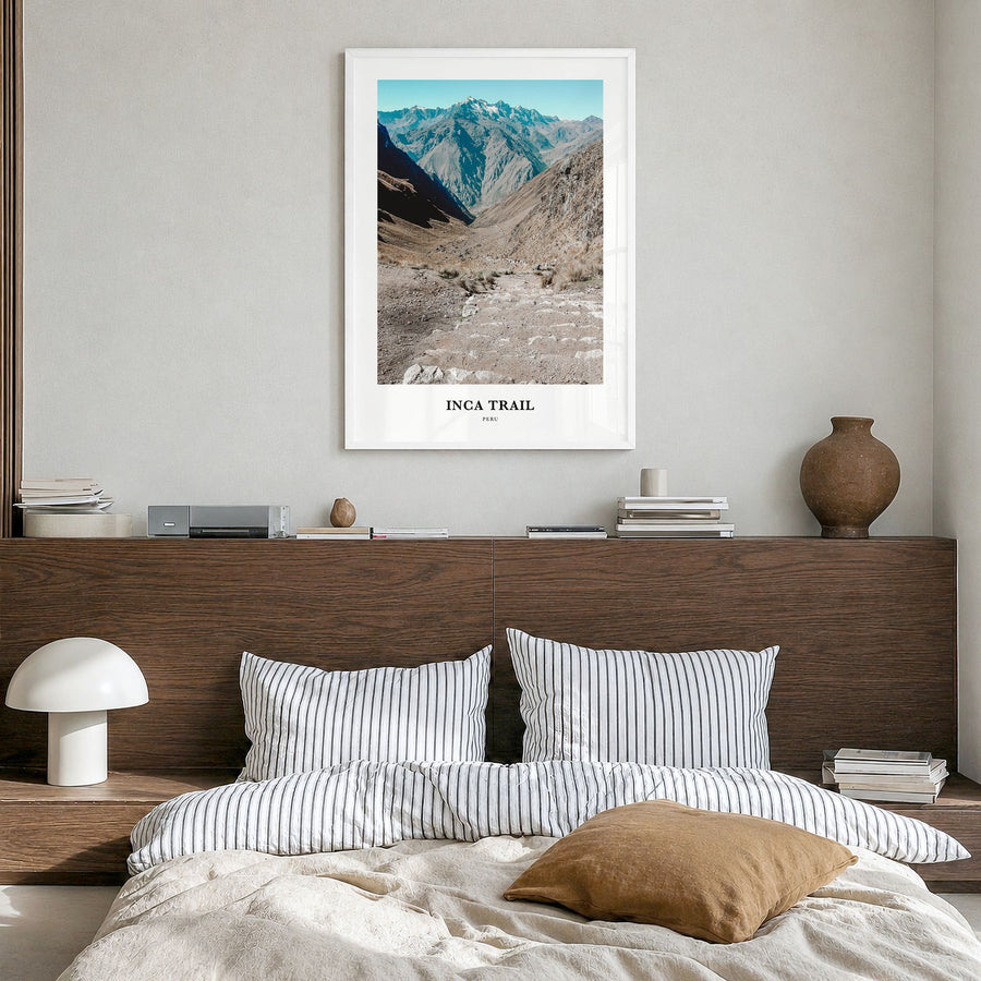 Inca Trail Classic Poster in a white wood frame, hanging in a bedroom