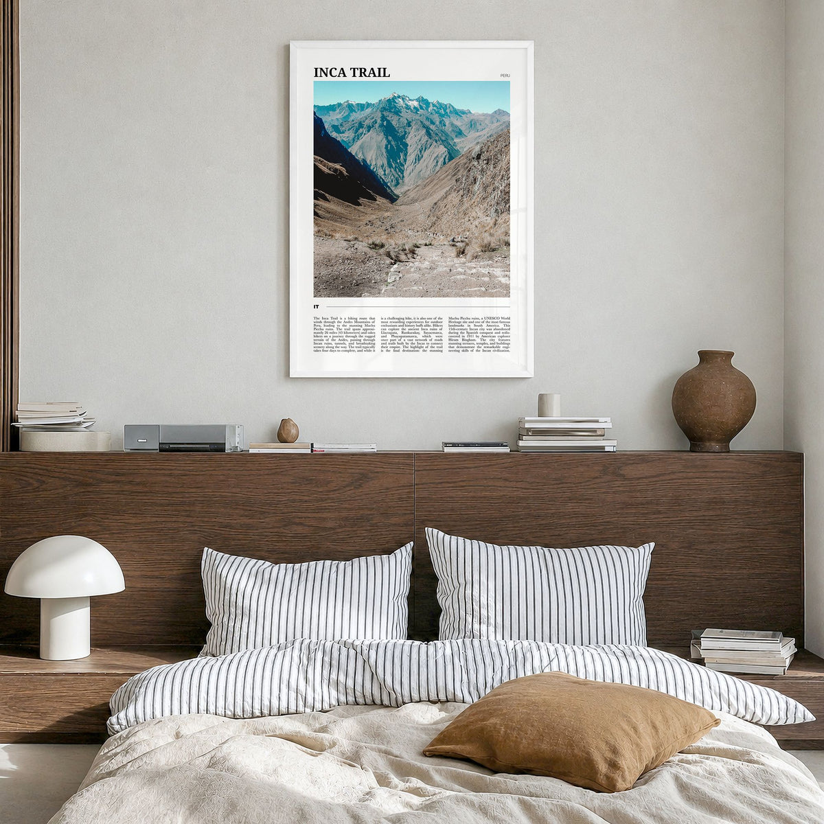 Inca Trail Travel Poster in a white wood frame, hanging in a bedroom