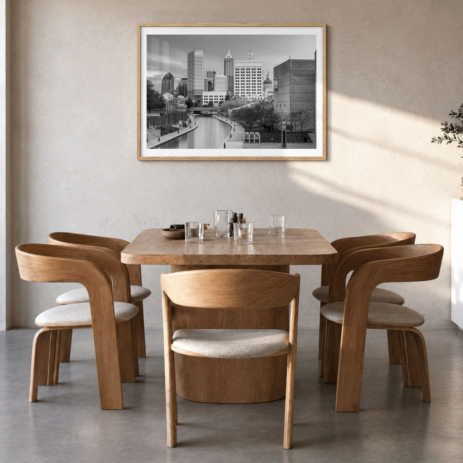 Indianapolis Photo Poster in a natural wood frame, hanging in a dining room, white border