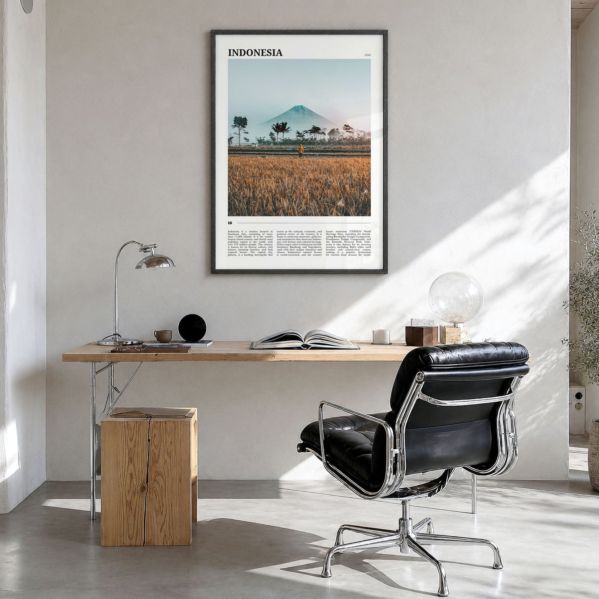 Indonesia Travel Poster in a black wood frame, hanging in a bright home office