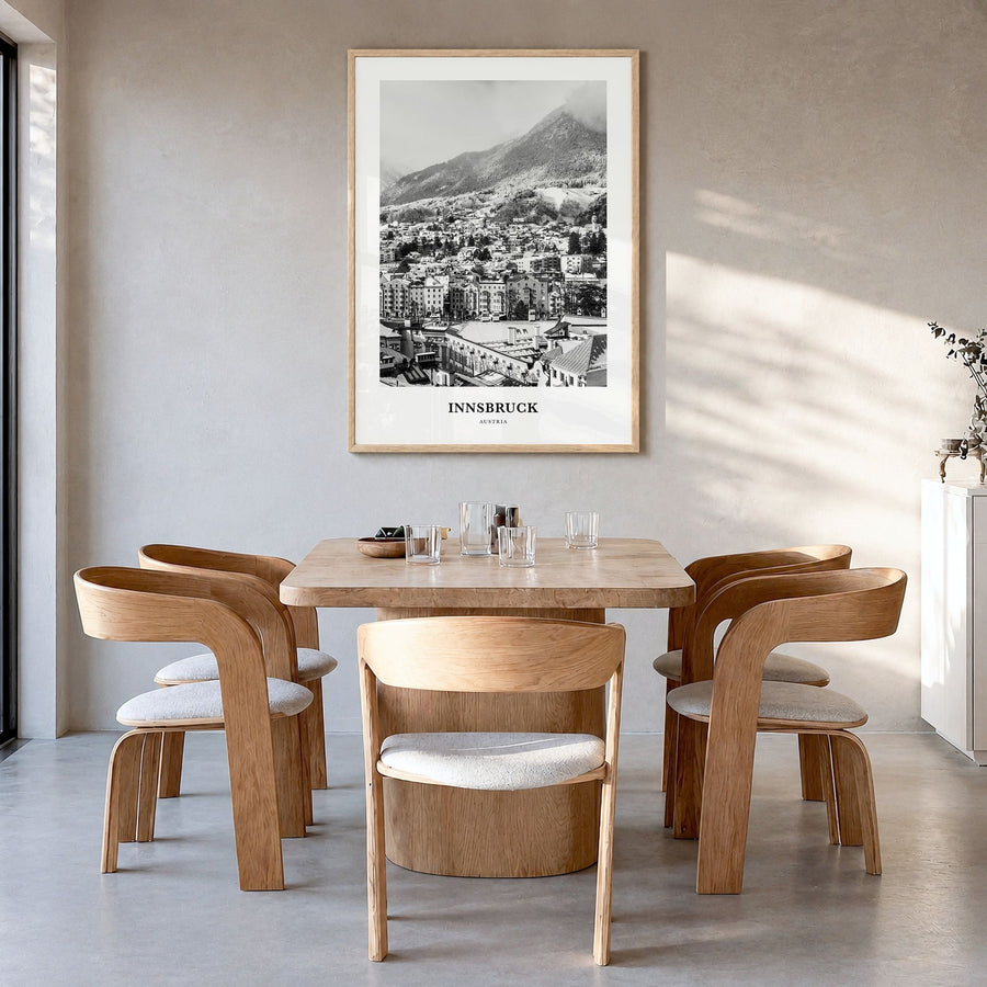 Innsbruck Classic Poster in a natural wood frame, hanging in a dining room