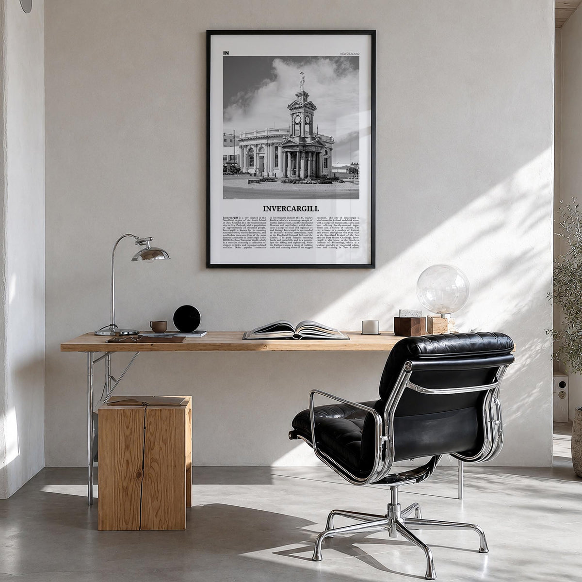 Invercargill black & white newspaper poster of New Zealand – vertical wall art in black wood frame, hanging on wall