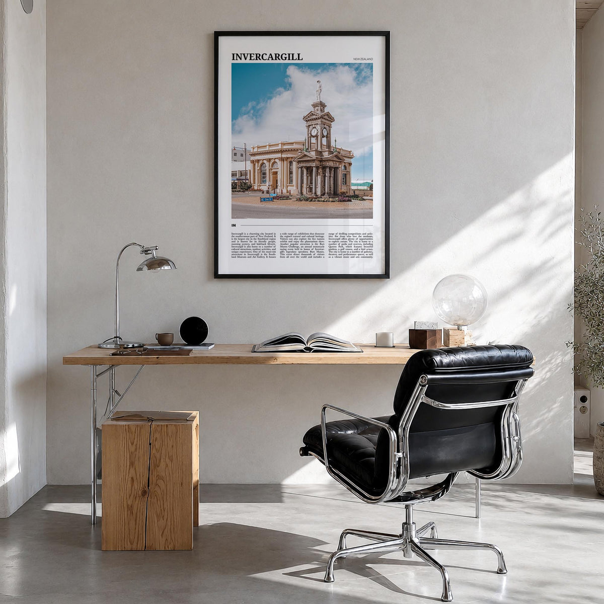 Invercargill colorful travel poster of New Zealand – vertical wall art in black wood frame, hanging on wall