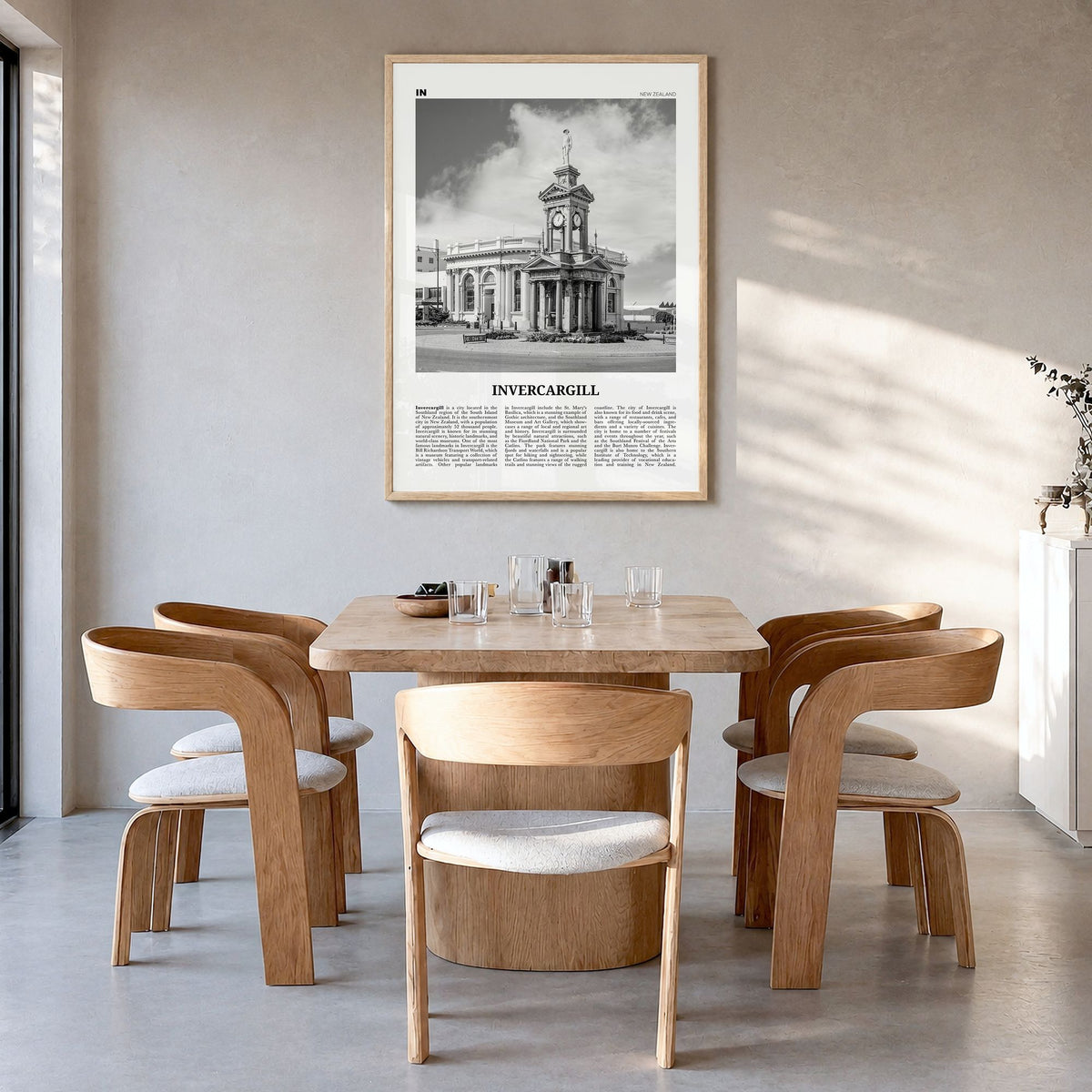 Invercargill Newspaper Poster in a natural wood frame, hanging in a dining room