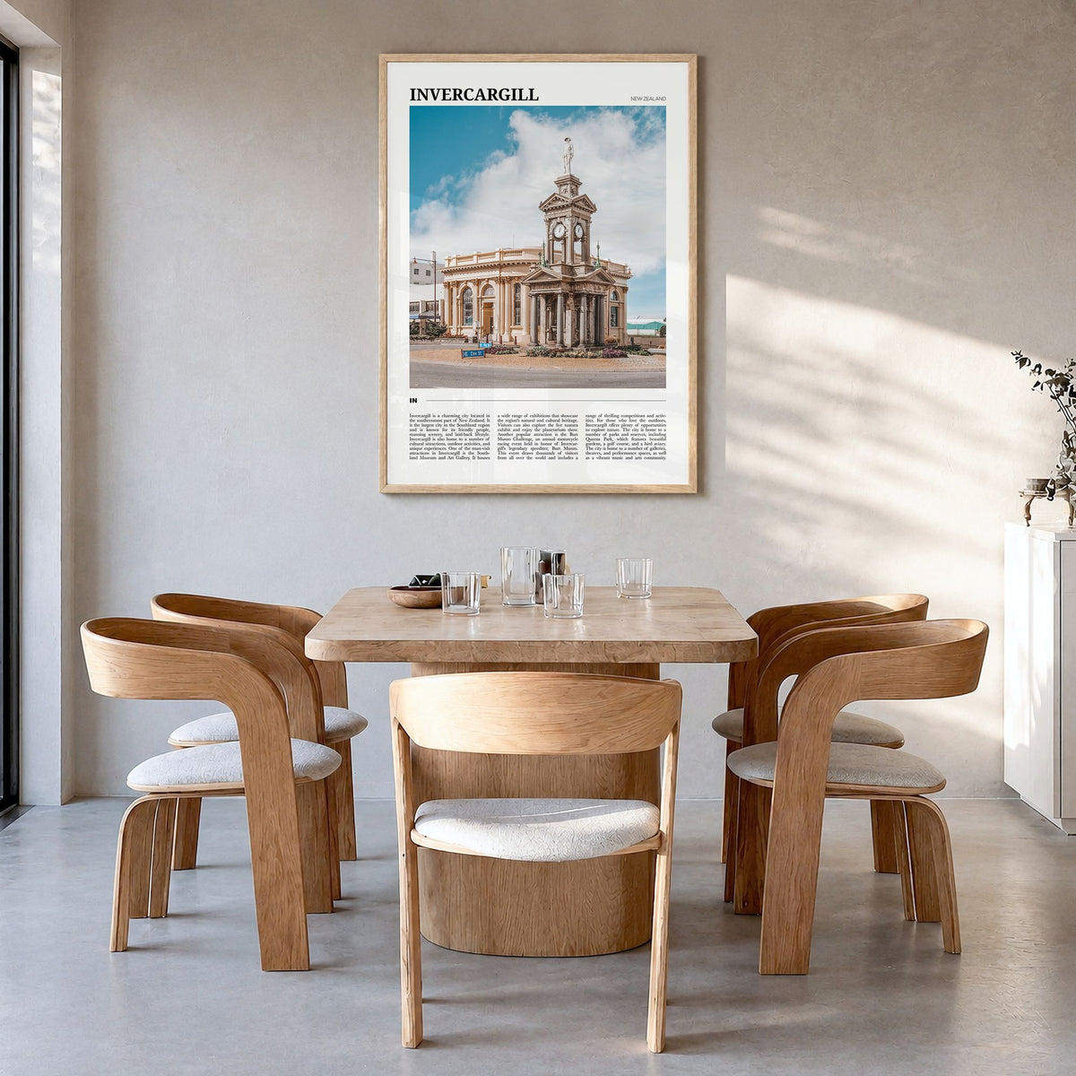 Invercargill Travel Poster in a natural wood frame, hanging in a dining room