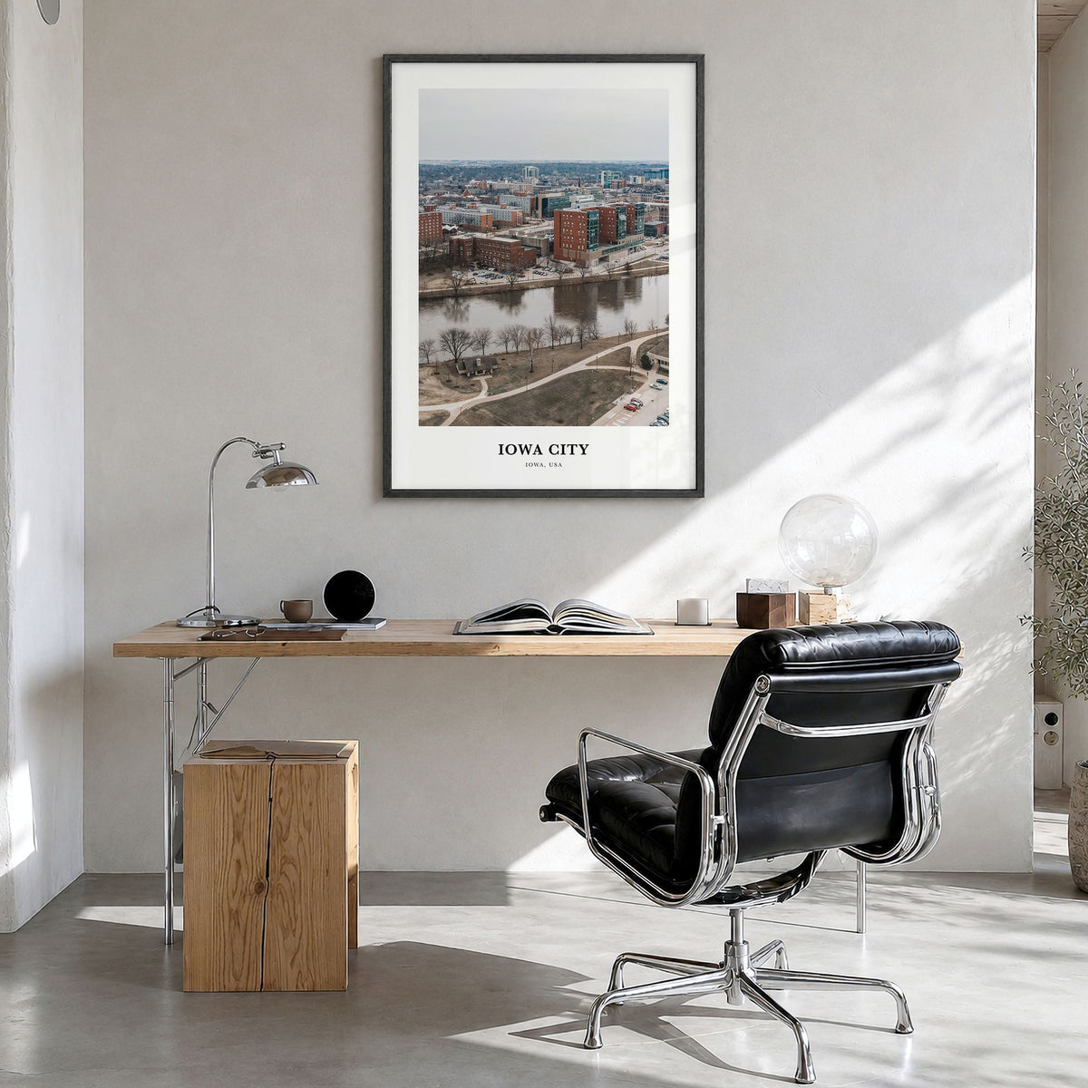 Iowa City Classic Poster in a black wood frame, hanging in a bright home office