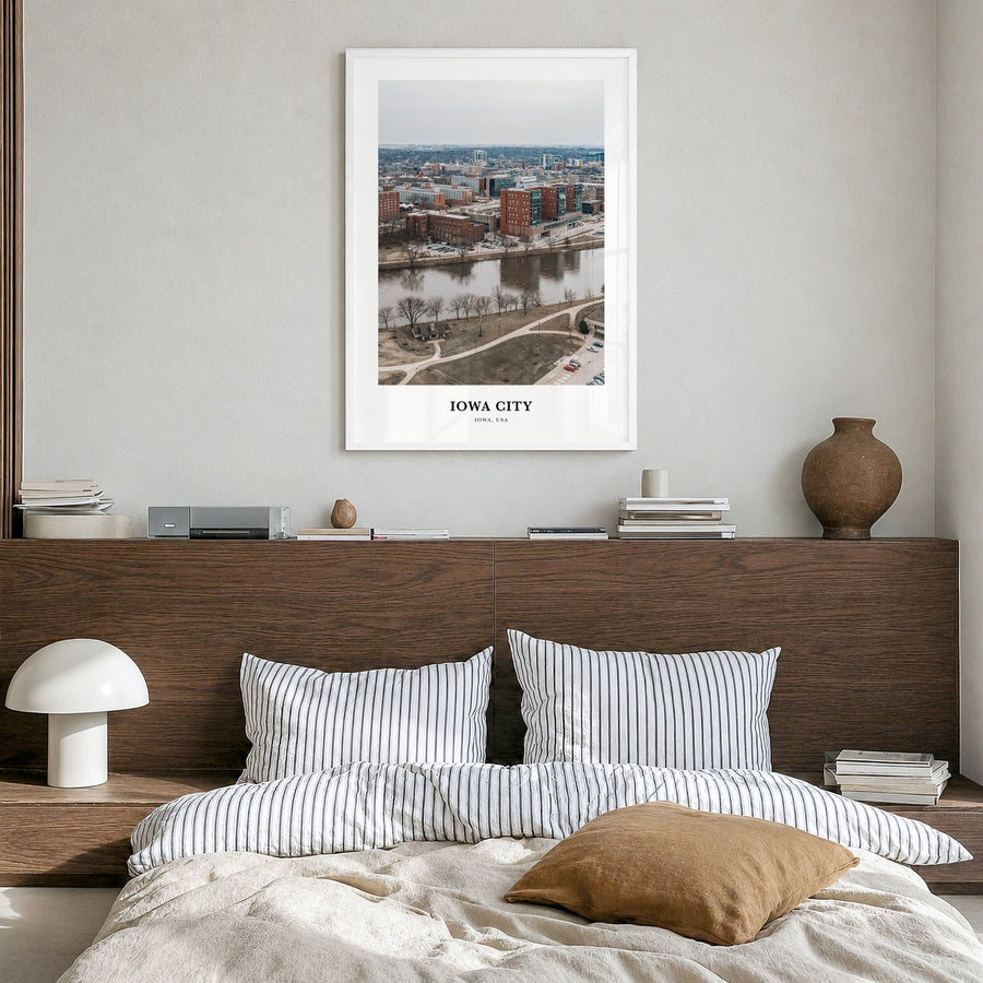 Iowa City Classic Poster in a white wood frame, hanging in a bedroom