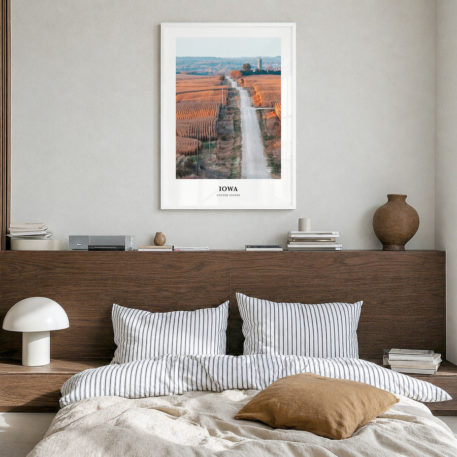 Iowa Classic Poster in a white wood frame, hanging in a bedroom