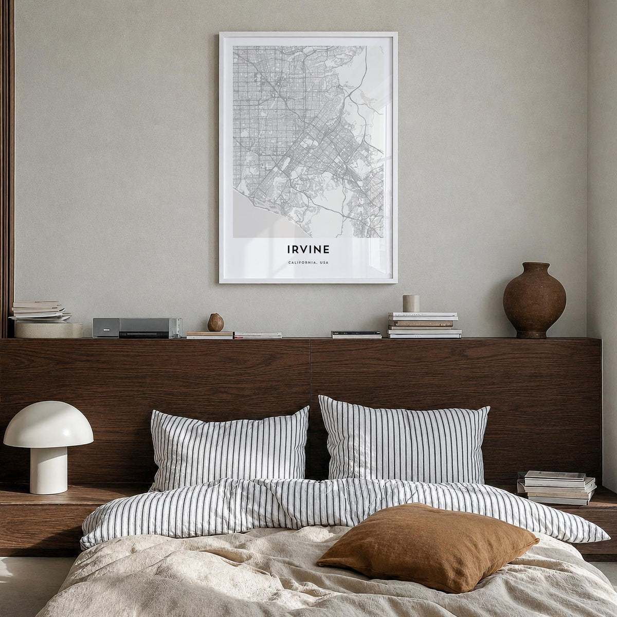 Irvine black & white map poster of California, USA – vertical wall art in white wood frame, hanging on wall