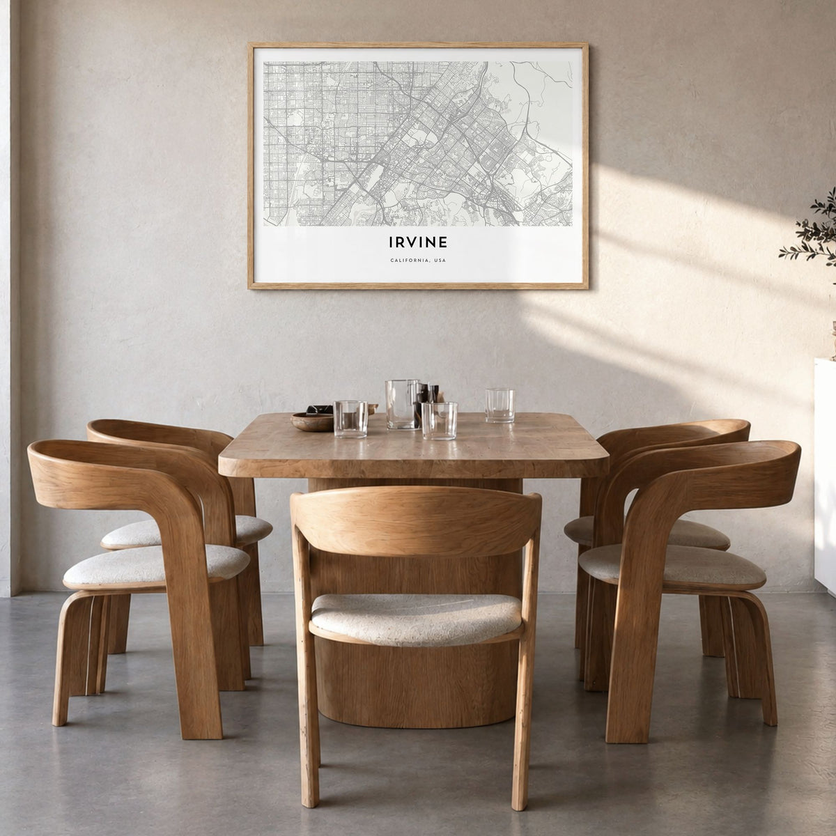 Irvine Map Poster in a natural wood frame, hanging in a dining room