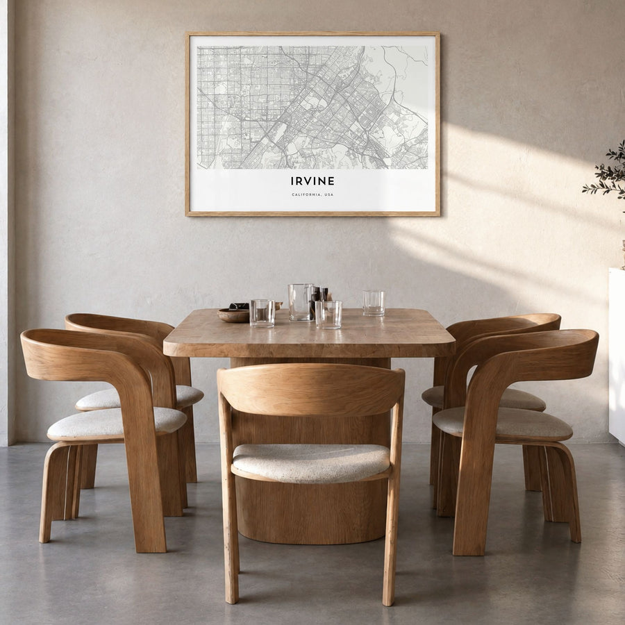 Irvine Map Poster in a natural wood frame, hanging in a dining room