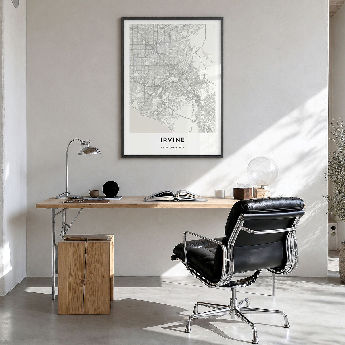 Irvine Map Poster in a black wood frame, hanging in a bright home office