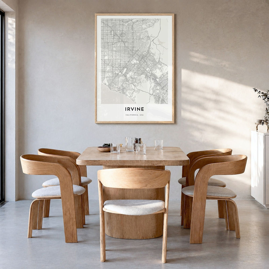 Irvine Map Poster in a natural wood frame, hanging in a dining room