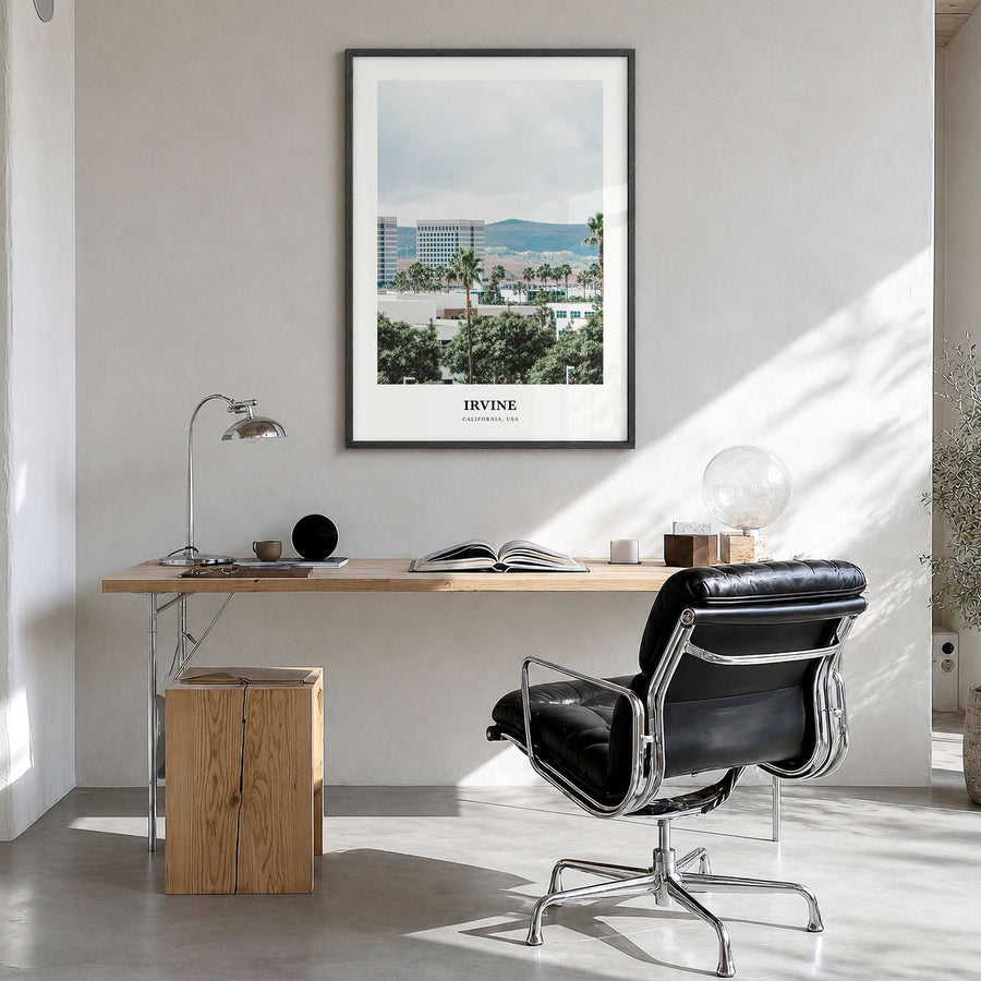 Irvine Classic Poster in a black wood frame, hanging in a bright home office