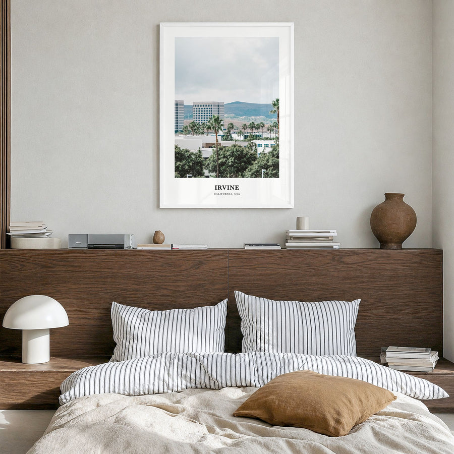 Irvine Classic Poster in a white wood frame, hanging in a bedroom