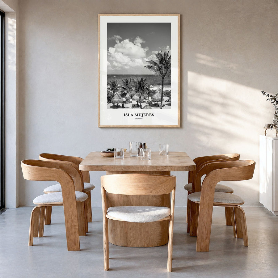 Isla Mujeres Classic Poster in a natural wood frame, hanging in a dining room