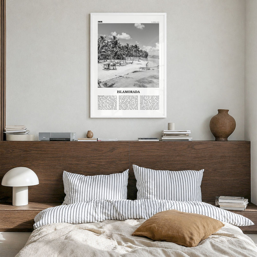 Islamorada Newspaper Poster in a white wood frame, hanging in a bedroom