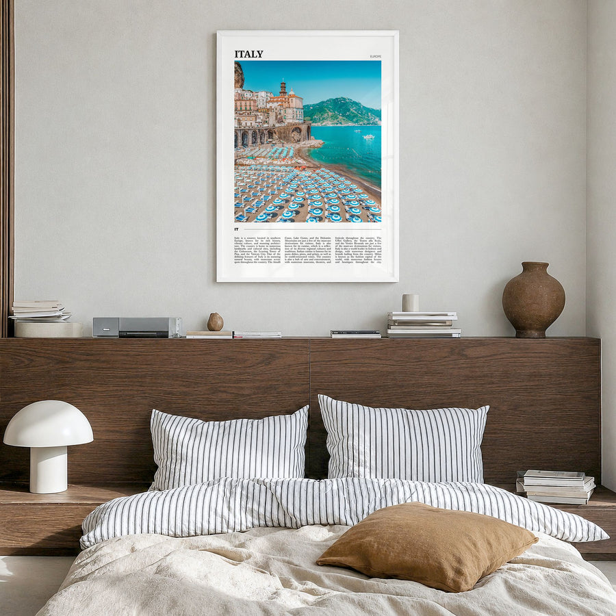 Italy Travel Poster in a white wood frame, hanging in a bedroom