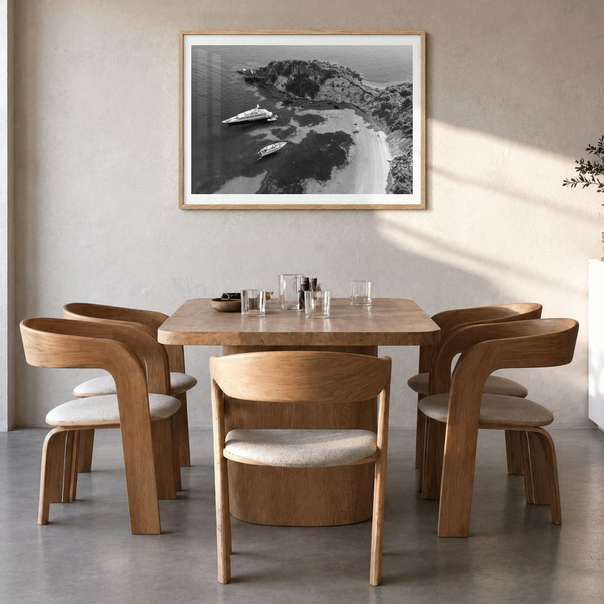 Ithaca Photo Poster in a natural wood frame, hanging in a dining room, white border