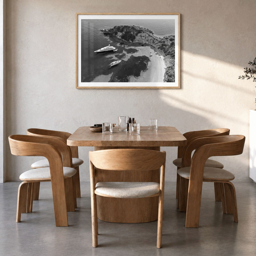 Ithaca Photo Poster in a natural wood frame, hanging in a dining room, white border