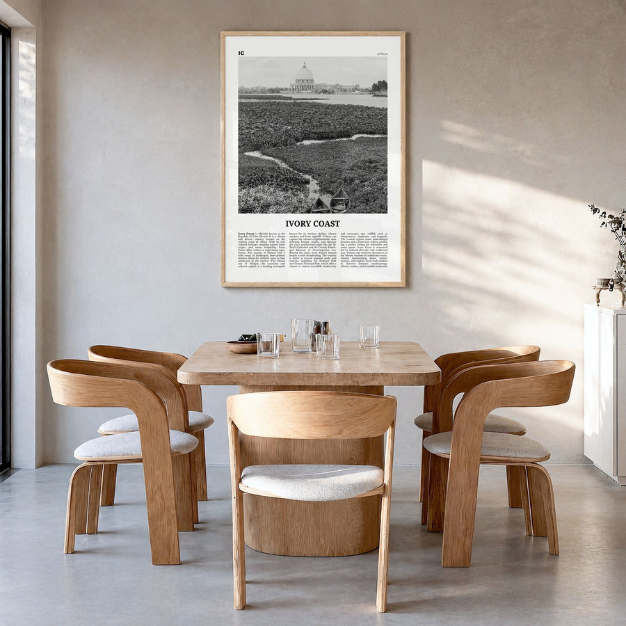 Ivory Coast Newspaper Poster in a natural wood frame, hanging in a dining room