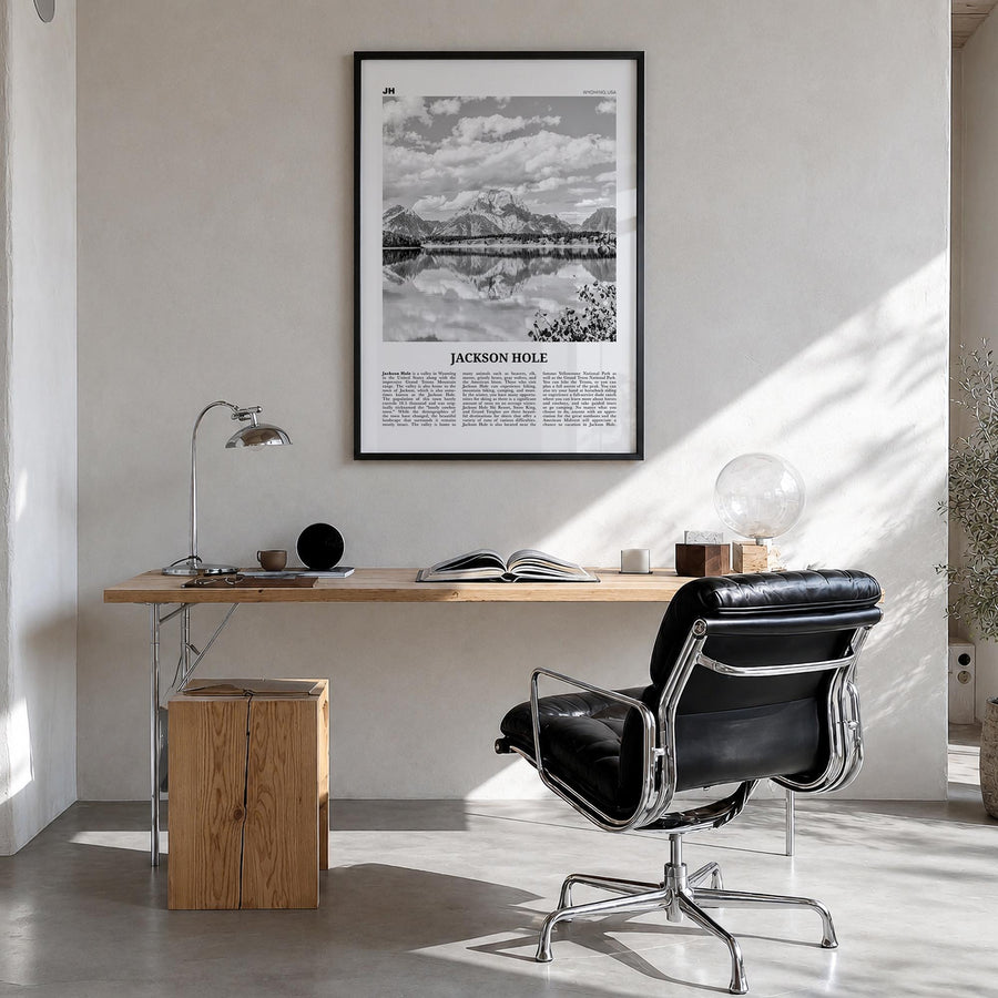 Jackson Hole black & white newspaper poster of Wyoming, USA – vertical wall art in black wood frame, hanging on wall