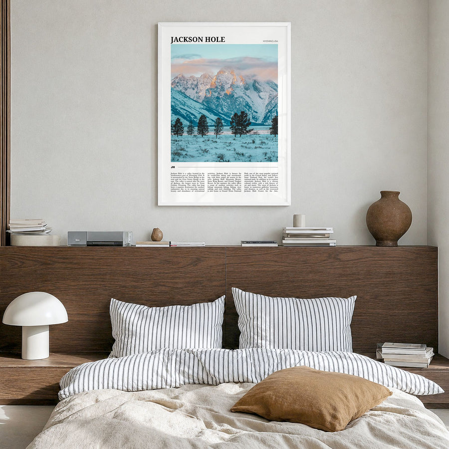 Jackson Hole Travel Poster in a white wood frame, hanging in a bedroom