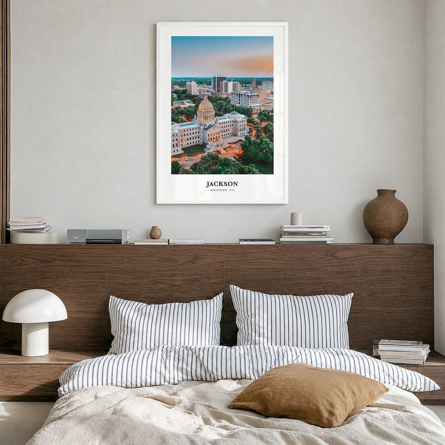 Jackson, Mississippi Classic Poster in a white wood frame, hanging in a bedroom