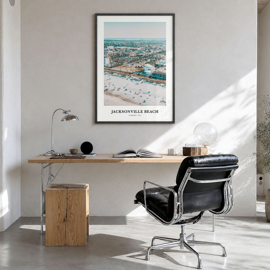 Jacksonville Beach Classic Poster in a black wood frame, hanging in a bright home office