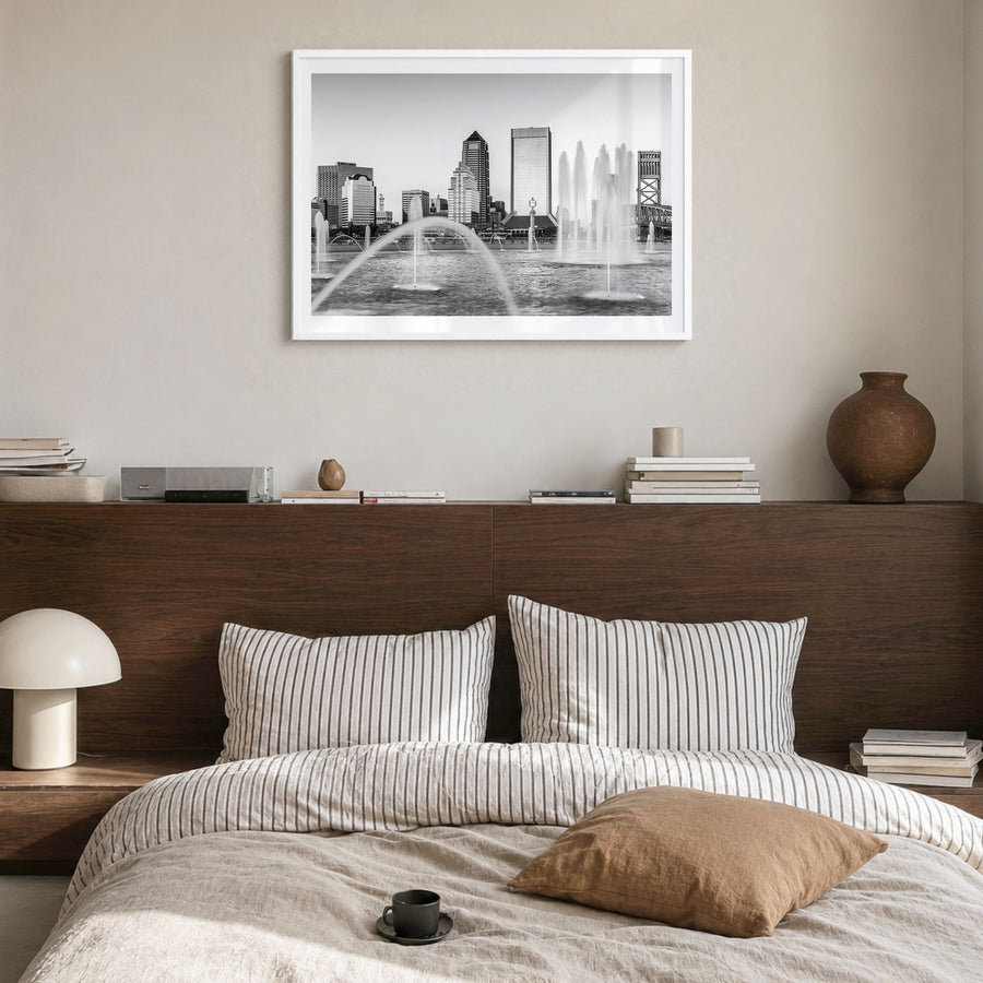 Jacksonville Photo Poster in a white wood frame, hanging in a bedroom, white border