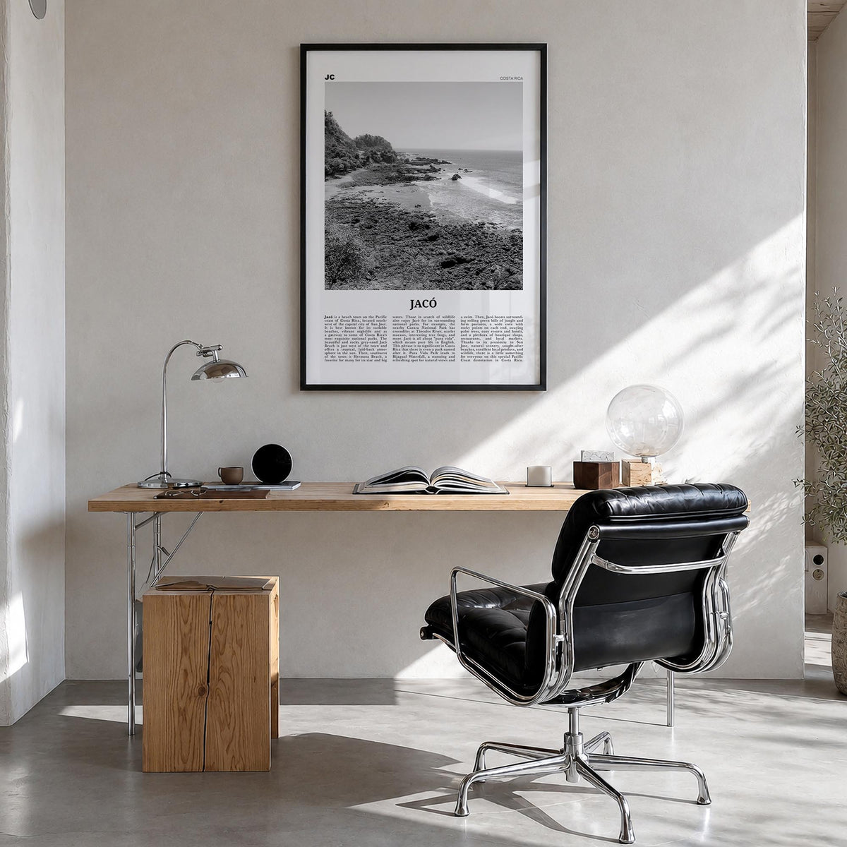 Jacó black & white newspaper poster of Costa Rica – vertical wall art in black wood frame, hanging on wall